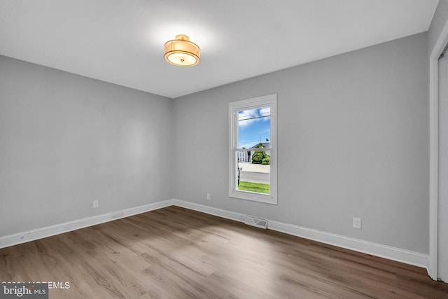 unfurnished room featuring wood-type flooring