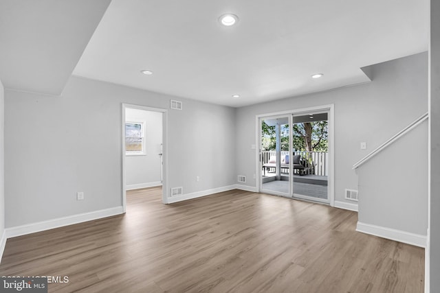 unfurnished living room with light wood-type flooring