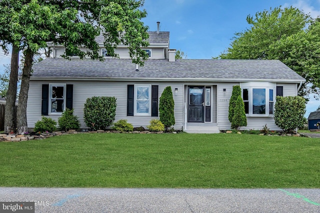 view of front of property with a front lawn