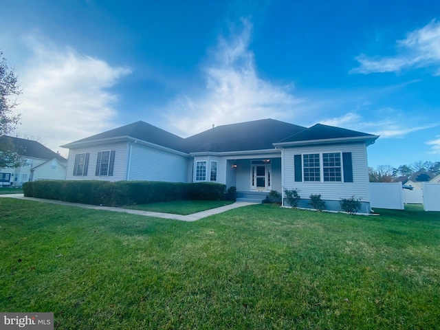 ranch-style home featuring a front yard