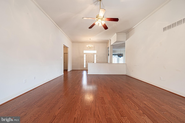 unfurnished living room with baseboards, visible vents, dark wood finished floors, and ornamental molding