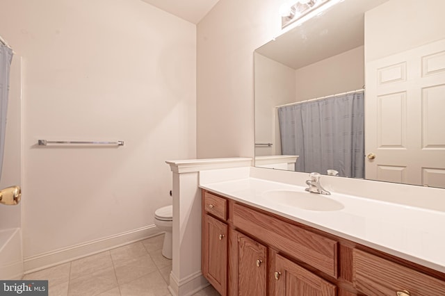 full bath featuring a shower with shower curtain, toilet, vanity, tile patterned flooring, and baseboards