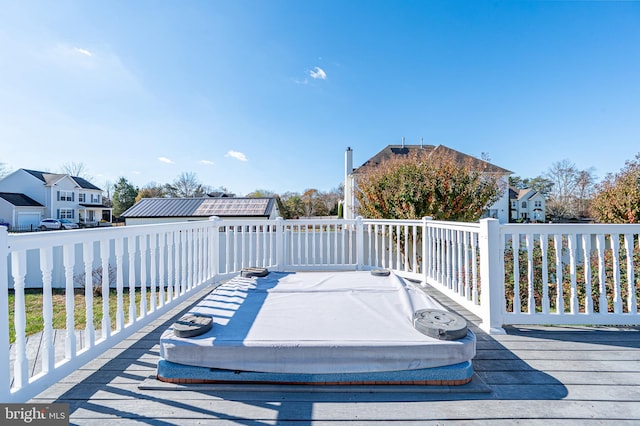 wooden terrace with a residential view