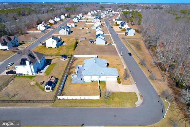 birds eye view of property with a residential view