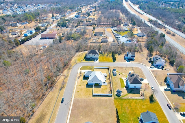 birds eye view of property with a residential view