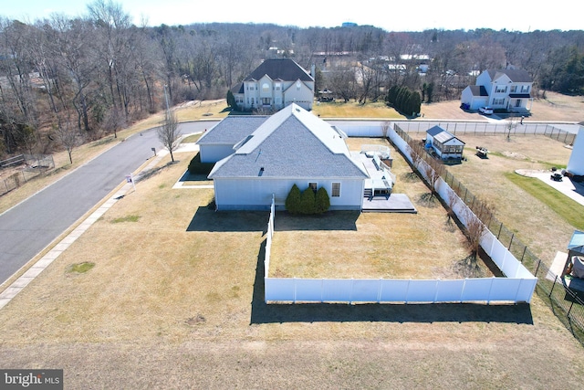 birds eye view of property with a wooded view