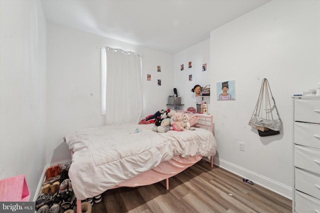 bedroom featuring hardwood / wood-style flooring