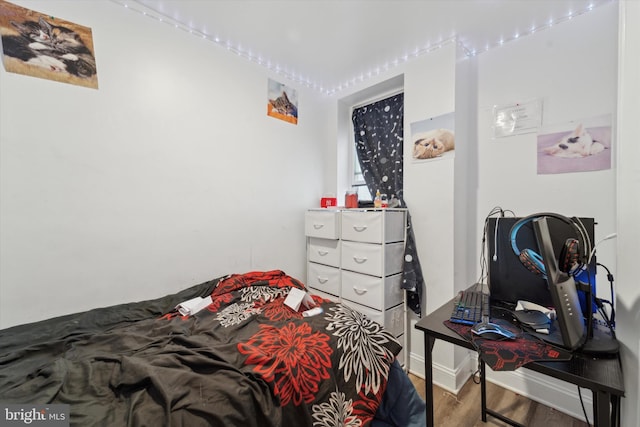 bedroom with wood-type flooring