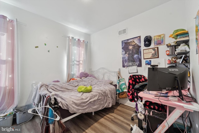 bedroom featuring hardwood / wood-style flooring