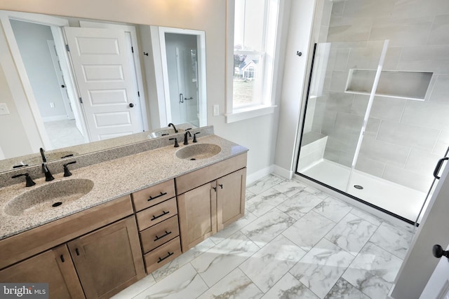 bathroom featuring vanity and a shower with door