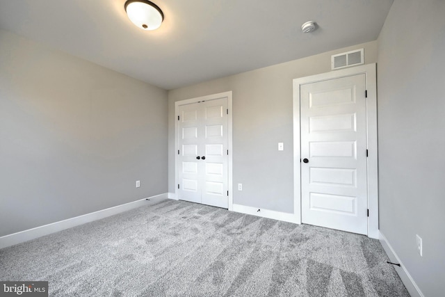 unfurnished bedroom featuring carpet flooring