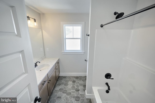 bathroom with bathing tub / shower combination, tile patterned flooring, and vanity