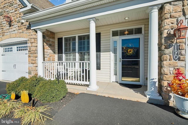 doorway to property with a porch