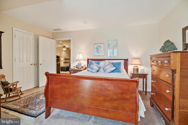 carpeted bedroom with a closet