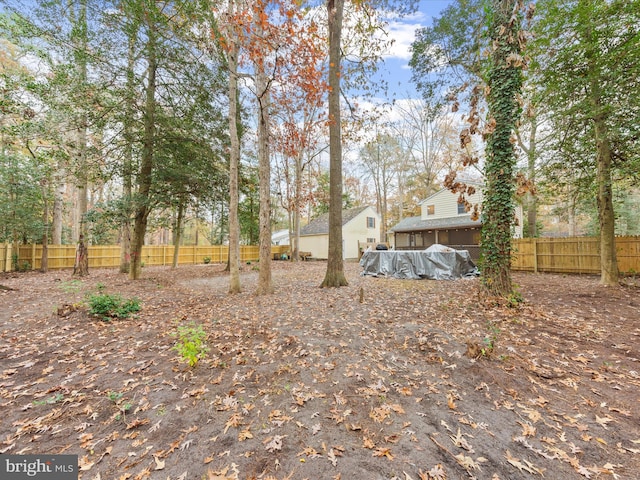 view of yard featuring a pool and a fenced backyard