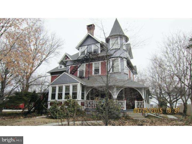 victorian-style house featuring a porch