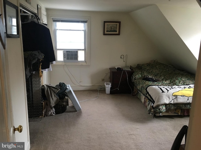 carpeted bedroom featuring cooling unit and lofted ceiling