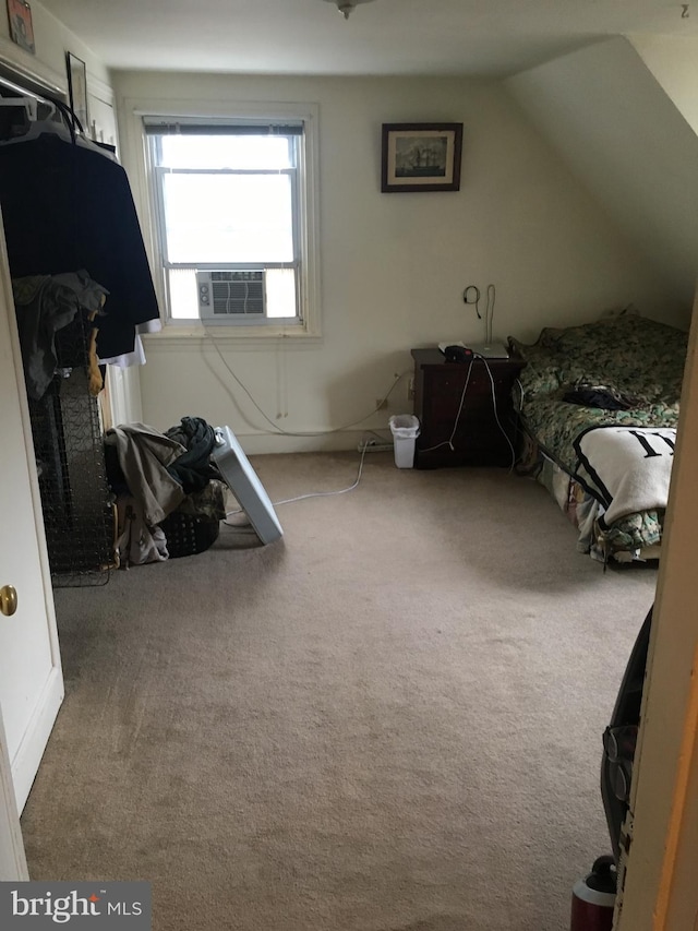 carpeted bedroom with cooling unit and lofted ceiling