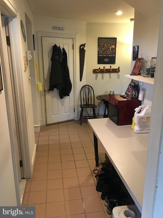 hallway featuring light tile patterned floors