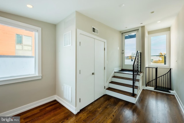 staircase featuring wood-type flooring