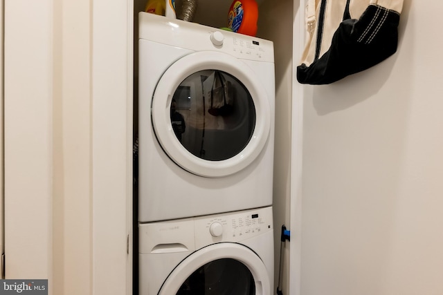 washroom with stacked washer / drying machine