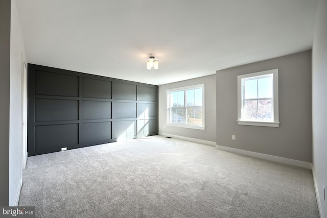 unfurnished bedroom with light carpet