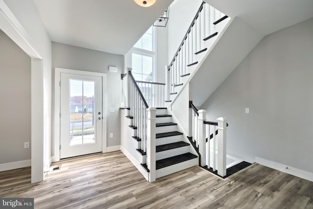 staircase with wood-type flooring