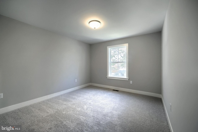 unfurnished room featuring carpet flooring