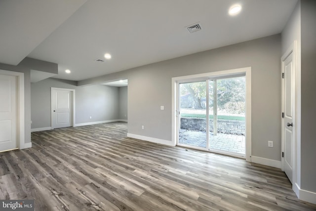 unfurnished living room featuring hardwood / wood-style flooring