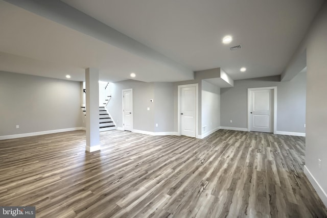 basement featuring light hardwood / wood-style flooring