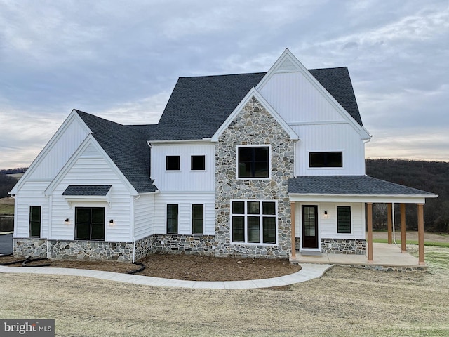 modern farmhouse style home with covered porch