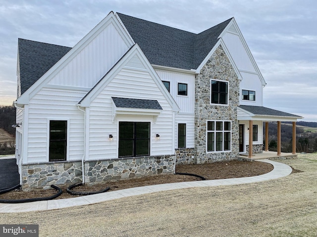 modern inspired farmhouse with covered porch