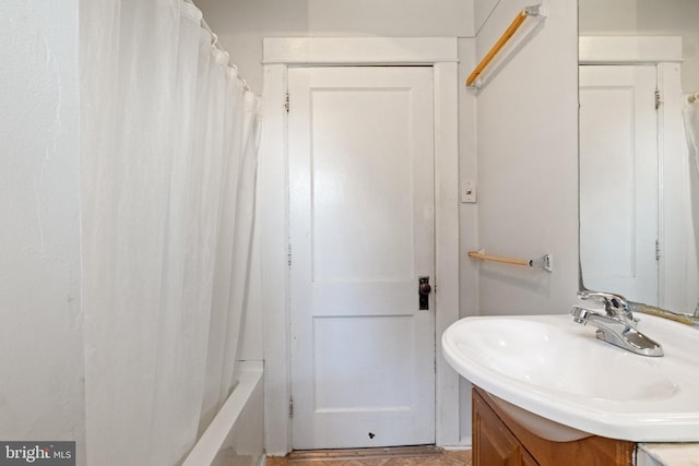 bathroom with vanity and shower / bath combo with shower curtain