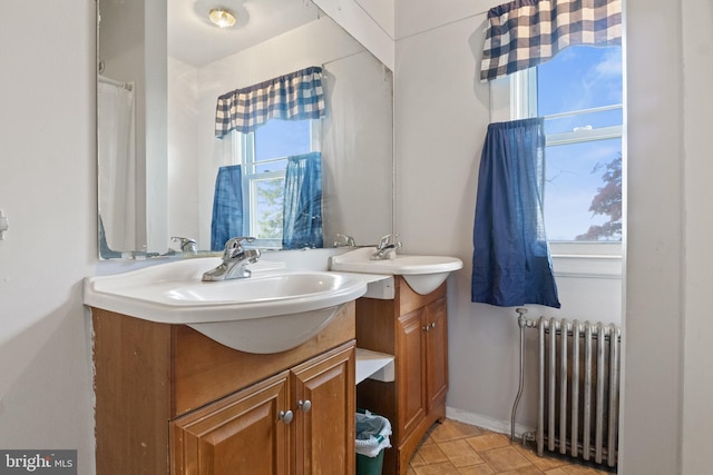 bathroom featuring vanity and radiator