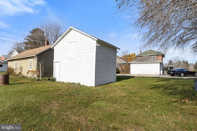 exterior space featuring an outdoor structure and a lawn