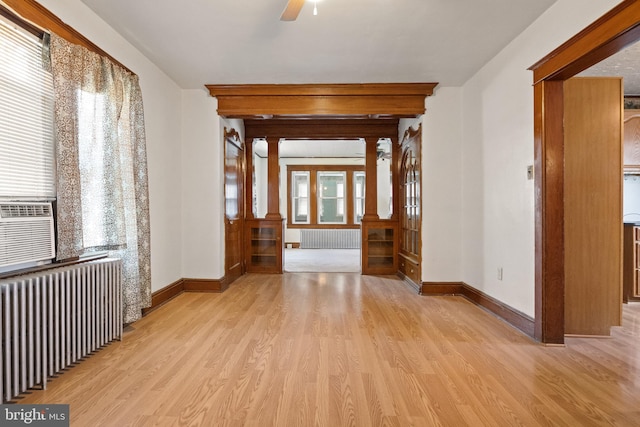 hall featuring light hardwood / wood-style flooring and radiator