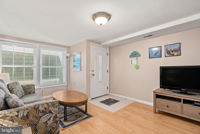 213 E Hand Ave, Wildwood, NJ 08260 - living area with baseboards and light wood-style floors