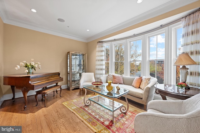 living room featuring light wood-type flooring and crown molding