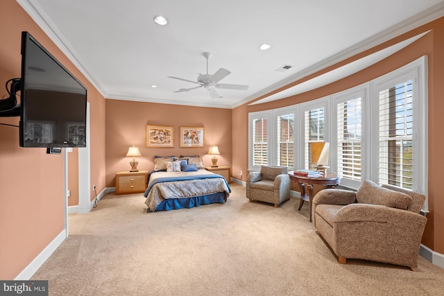 bedroom featuring light carpet, ceiling fan, and crown molding