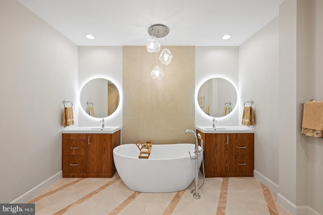 bathroom with tile patterned floors, vanity, a bath, and tile walls