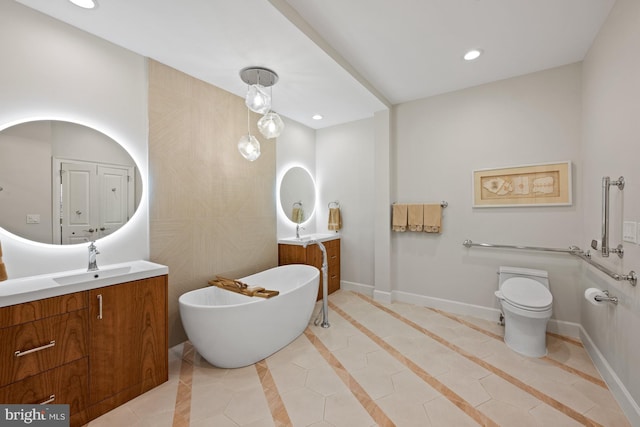 bathroom with vanity, tile walls, tile patterned flooring, toilet, and a tub