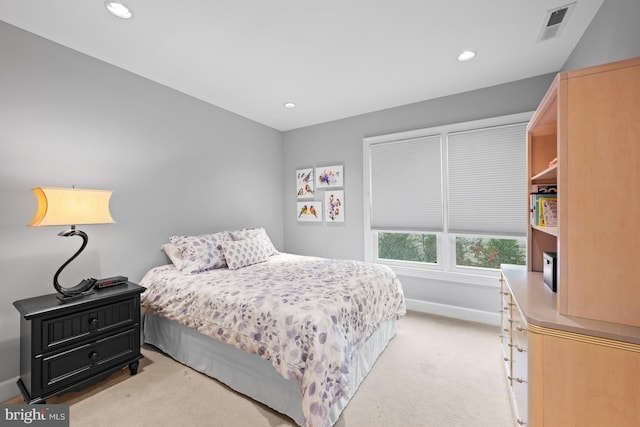 bedroom featuring light colored carpet