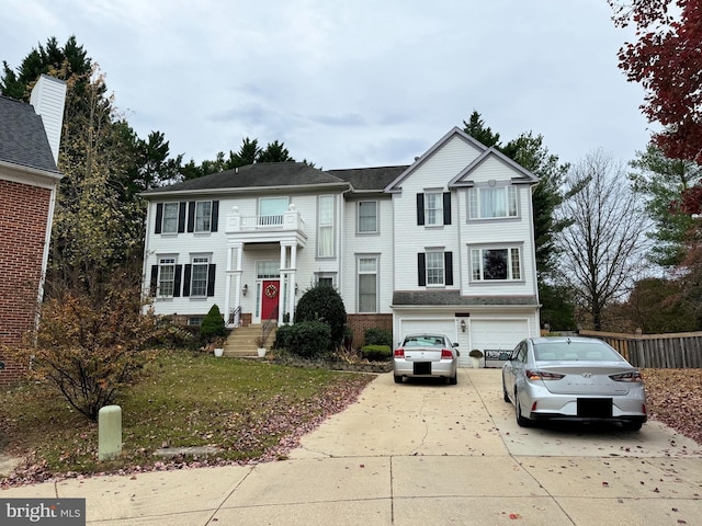 view of front facade featuring a front yard and a garage