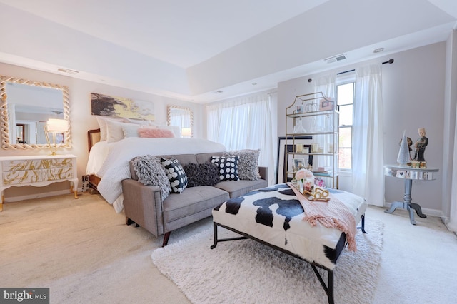 bedroom featuring light carpet