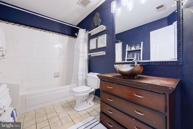 full bathroom featuring shower / bath combo with shower curtain, tile patterned flooring, vanity, and toilet