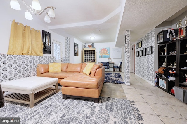 tiled living room with a textured ceiling and a chandelier