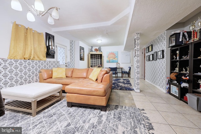 living room featuring wallpapered walls, a chandelier, and light tile patterned floors