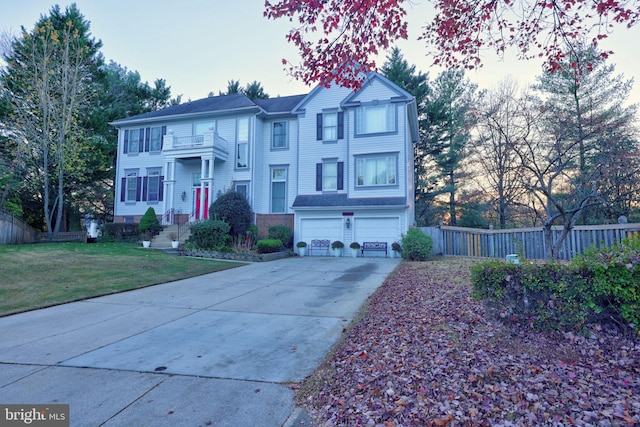 view of front of house with a garage and a front yard