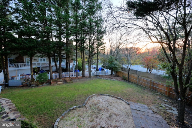 yard at dusk with a water view