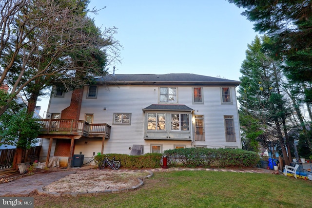 exterior space featuring a front lawn and cooling unit